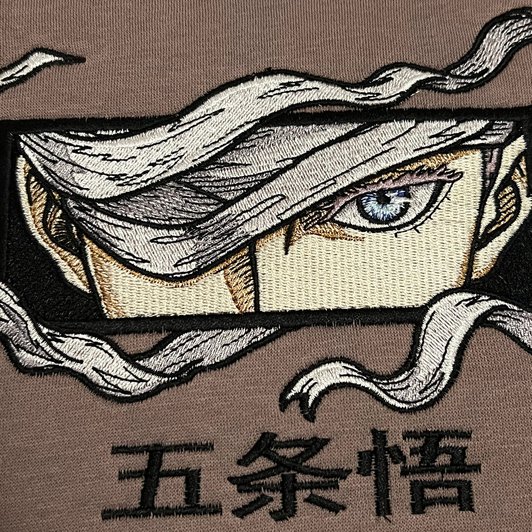 Hoodie brodé Eyes Satoru Gojo Kaito Global — photo produit avec motif brodé.